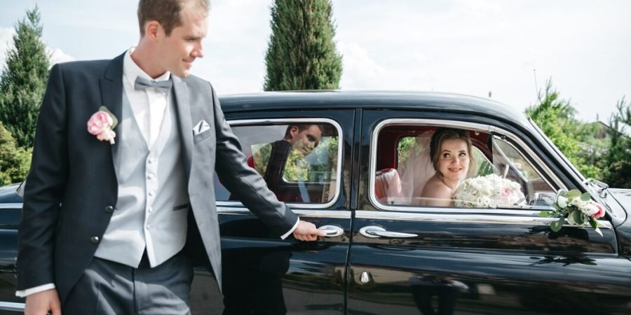 bridegroom-is-standing-by-car-while-bride-is-car_8353-9496