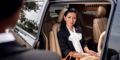 businesswoman-getting-taxi-cab_23-2149236691
